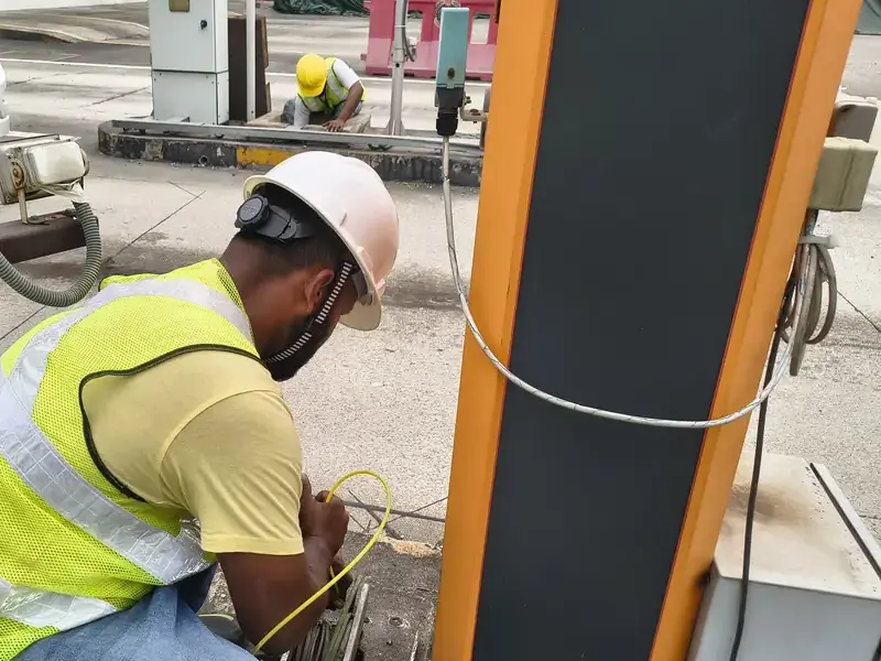 Licensed electrician repairing a power fault on site in Singapore
